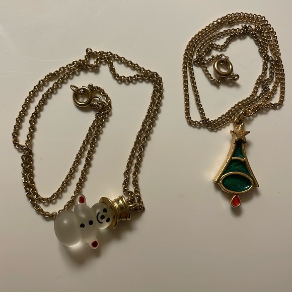 Avon Accessories - Festive Avon snowman and a christmas tree pendants/necklaces on gold tone chains